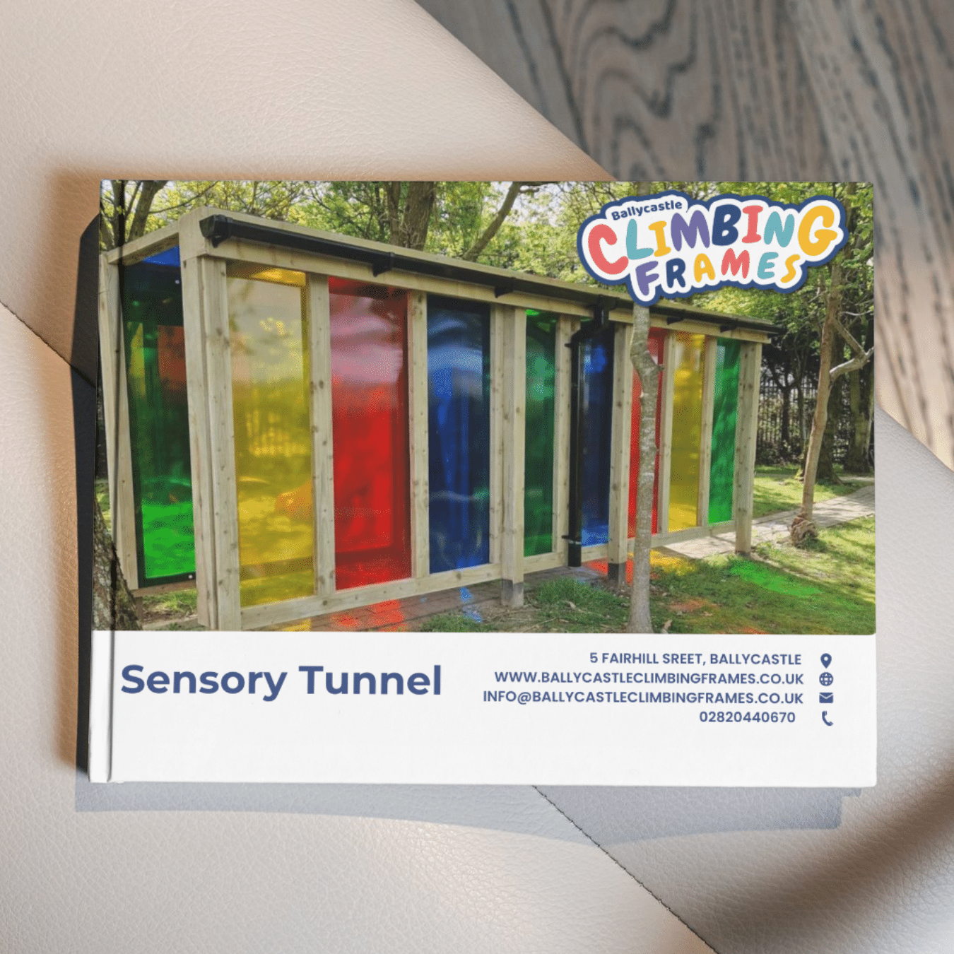 Colorful sensory tunnel with wooden frame at Ballycastle Climbing Frames.
