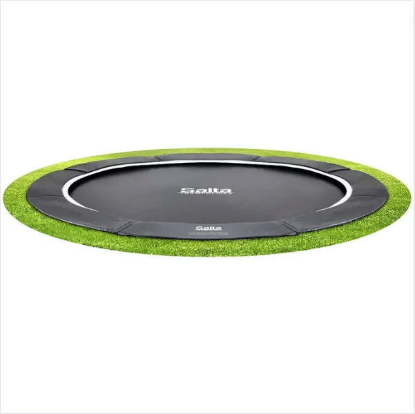 In-ground trampoline with black jumping mat and green edge.